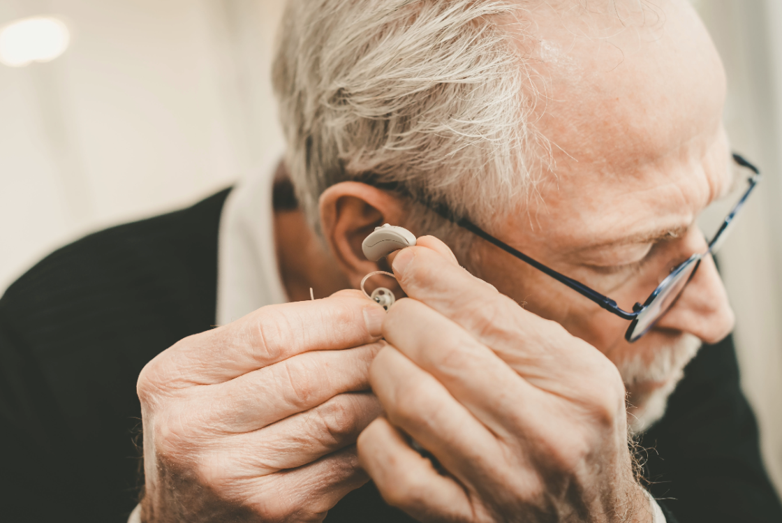 man using hearing aids